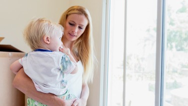 Mother and son near sliding glass patio door