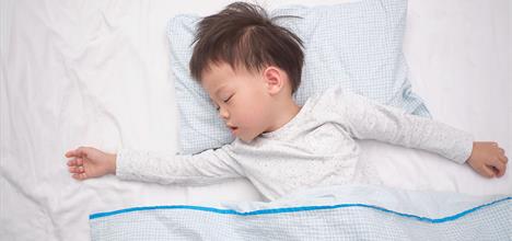 toddler sleeping in big kid bed